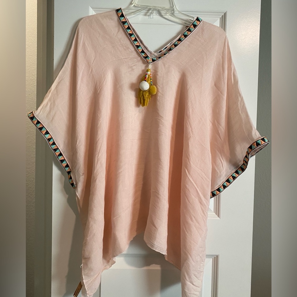 Super cute swimsuit cover up. Peach colored with ribbon and tassels. GUC